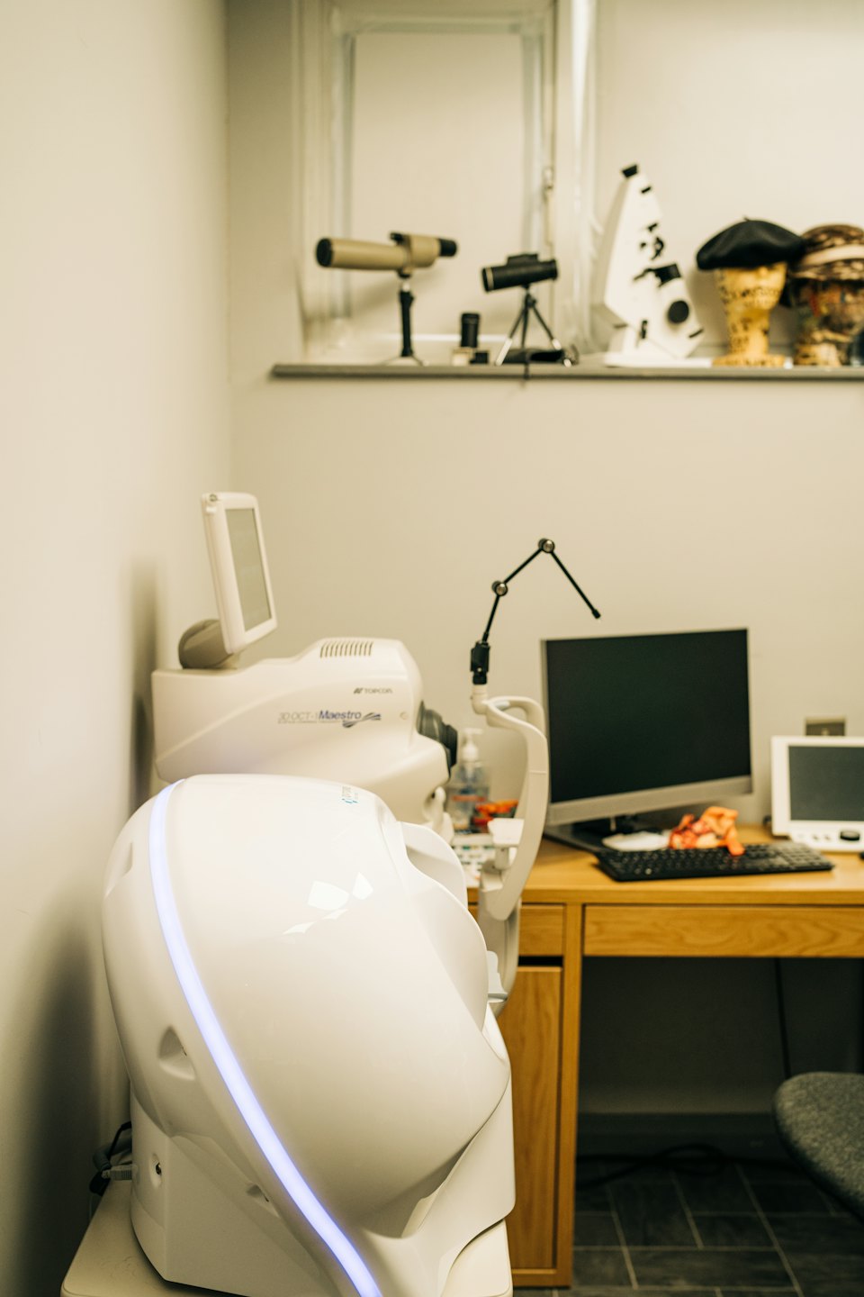 Advanced eye examination equipment inside a modern optometry clinic.